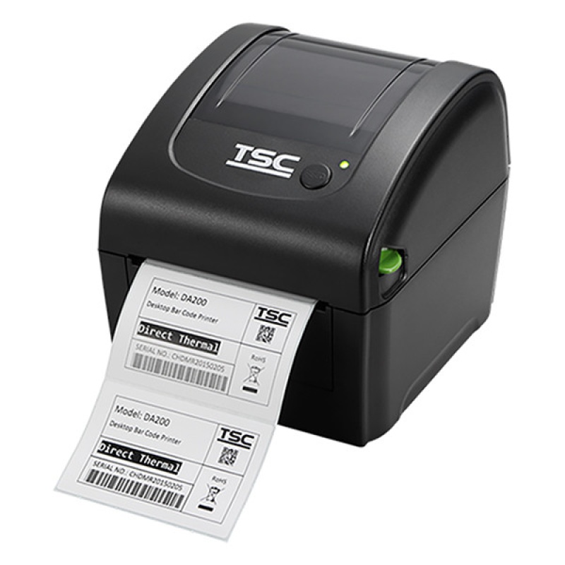 TSC DA210 label printer with printed labels coming out of the device.